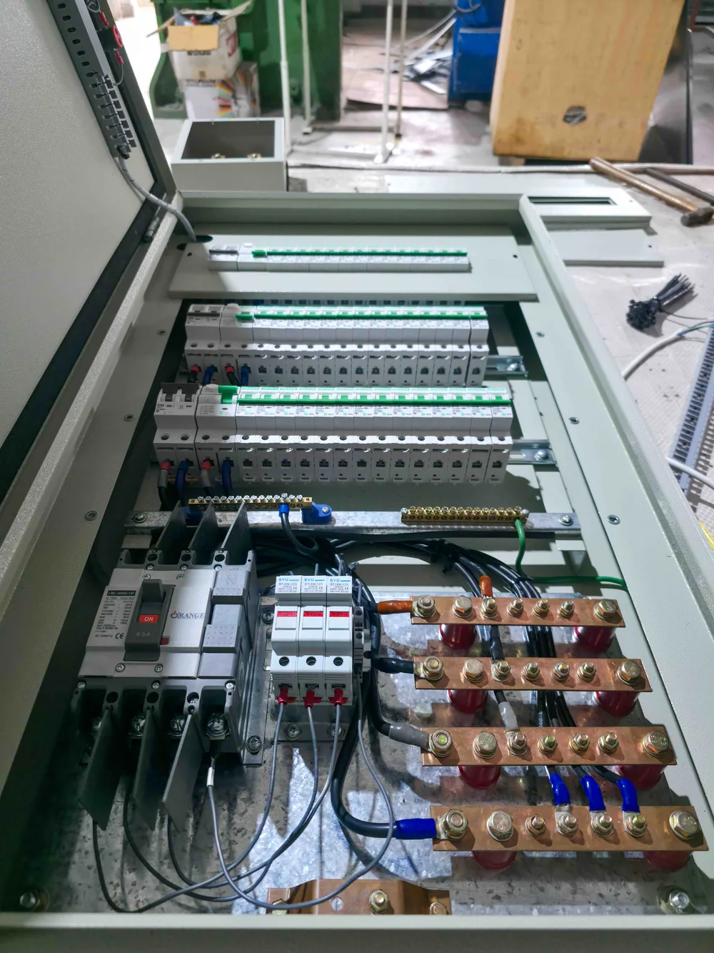 Open distribution assembly showing breakers, conductors and copper busbars